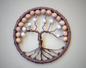 wire-wrapped tree of life home decor features brown wire branches with pearl-like beads, framed in green yarn. 